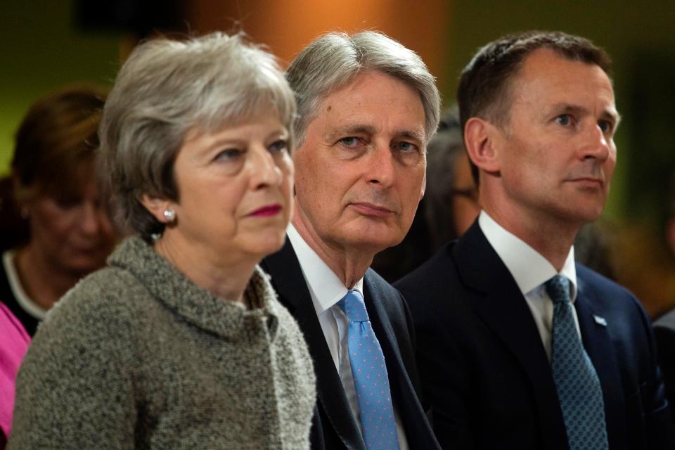  The PM with Philip Hammond and Jeremy Hunt before her speech