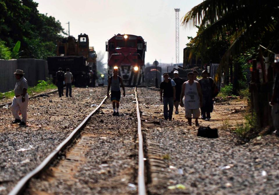  Central American immigrants and relatives take part in a demonstration next to a freight train in Coatzacoalcos