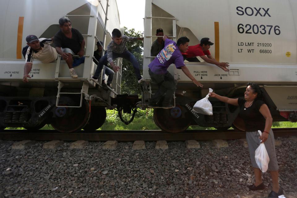  A woman from a group called "Las Patronas" (The bosses), a charitable organisation that feeds Central American immigrants who travel atop a freight train