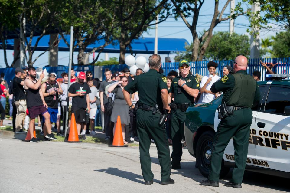  Police were at the scene of the memorial, which drew a huge crowd of fans
