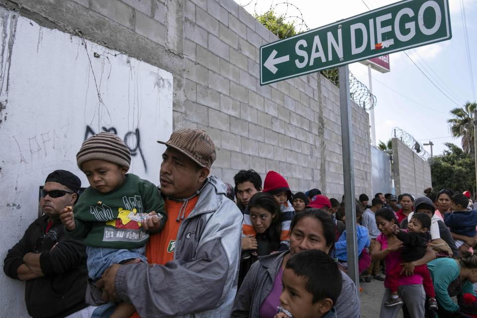  Central American migrants travelling in the "Migrant Via Crucis" queue outside the Padre Chava's kitchen soup for breakfast and legal counselling