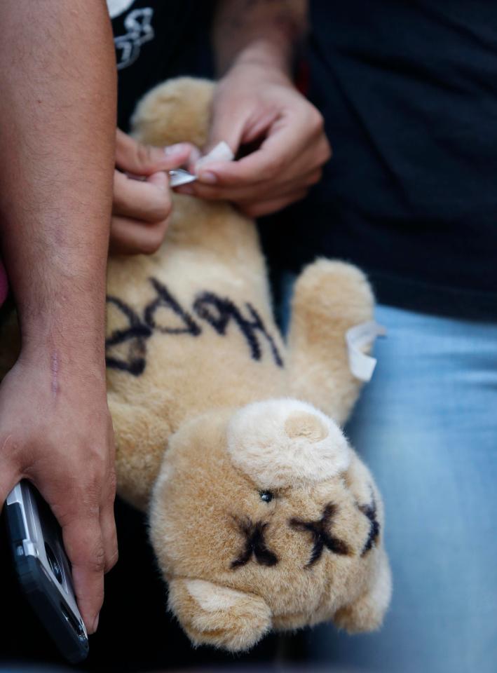  A teddy covered with 3 Xs to mark the rapper's stage name was brought to the memorial