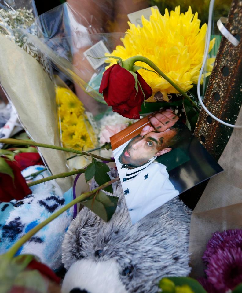  A picture of the young rapper was among tributes left at the scene on Tuesday
