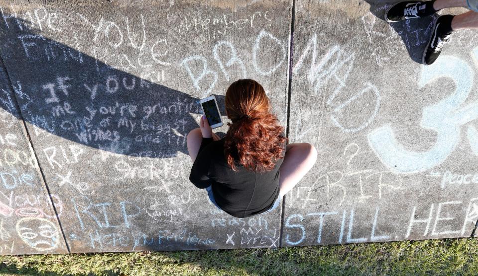  The pavement was covered in chalk scribbles with people paying tribute to the rapper