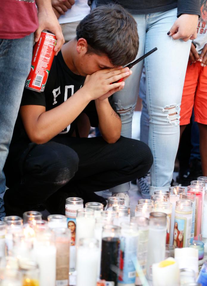  People lit candles and held a moments silence as they prayed for the slain rap star