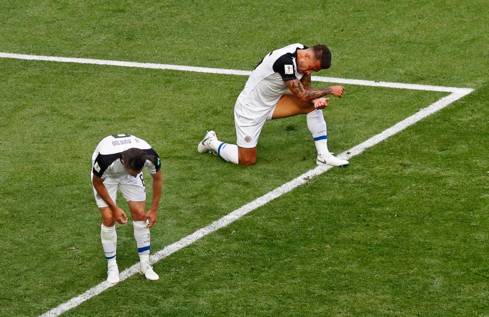  Costa Rica players are in tears after defeat to Brazil ended their World Cup hopes