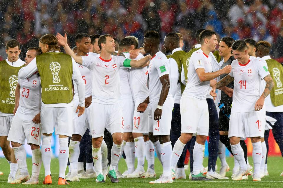  Switzerland celebrate after their last-gasp win over Serbia
