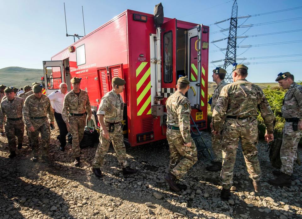  Exhausted firefighters have today been joined by 100 soldiers