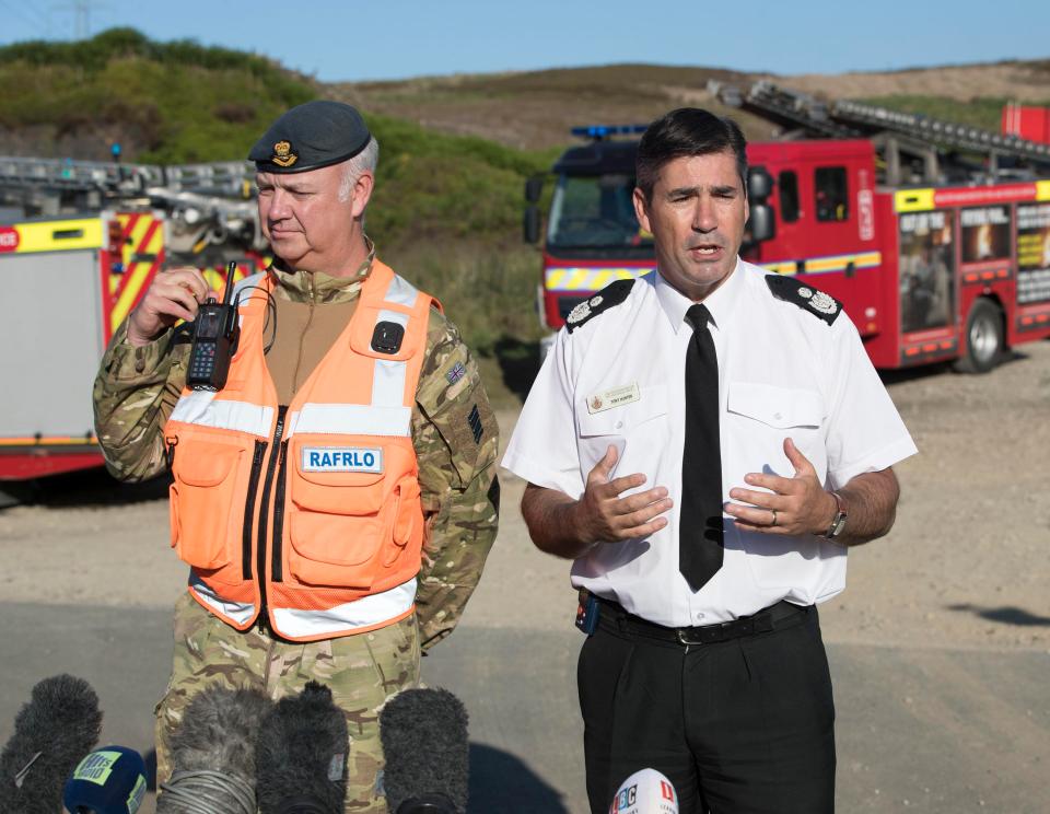  Wing Commander Gary Lane and Assistant Chief Fire Officer Tony Hunter appear before media today