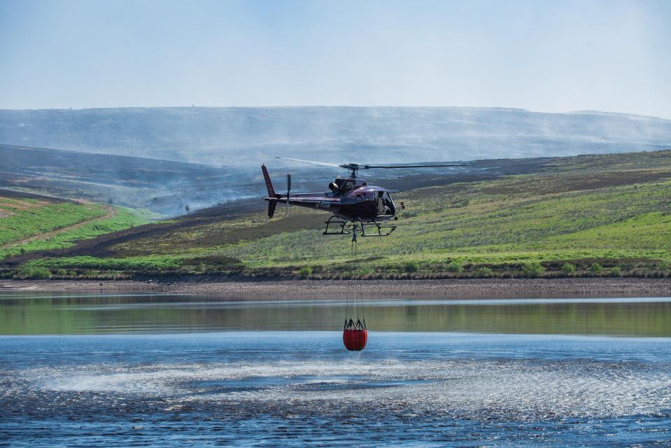  Helicopters fill up on water at nearby Dove Stone reservoir