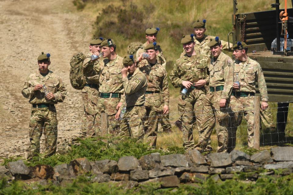 Troops from the 4th Battalion, Royal Regiment of Scotland keep hydrated in the heat today