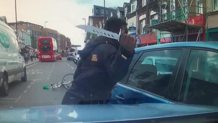 The cyclist had pulled the huge blade from his waistband to confront the driver