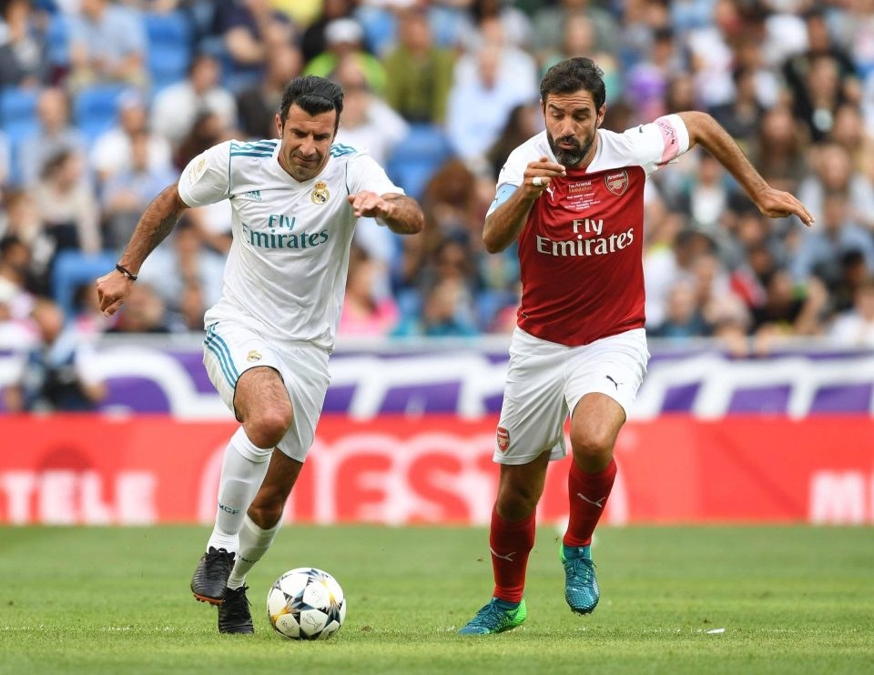  Robert Pires chases down Portuguese legend Luis Figo