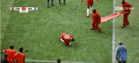  The stretcher bearers try to keep up as the 'injured' player rolls away