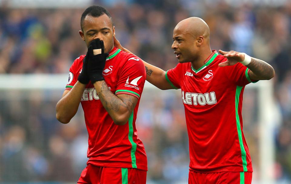 Jordan Ayew, left, will be joining his brother Andre in heading out of the exit door at the Liberty Stadium this summer