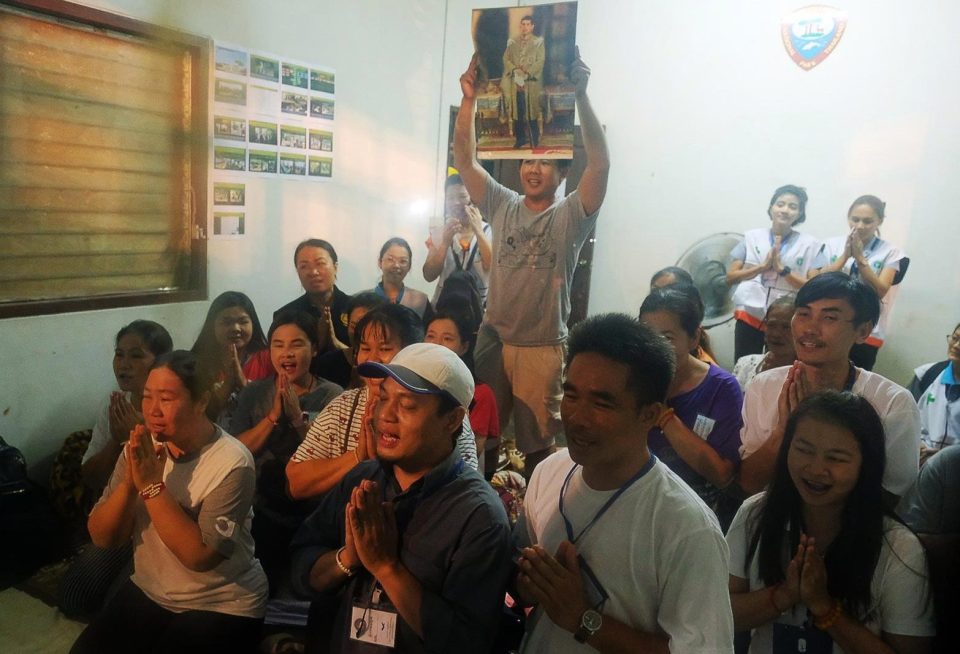 Relatives of the missing boys pray for them after the 12 boys and their soccer coach have been found alive in the cave