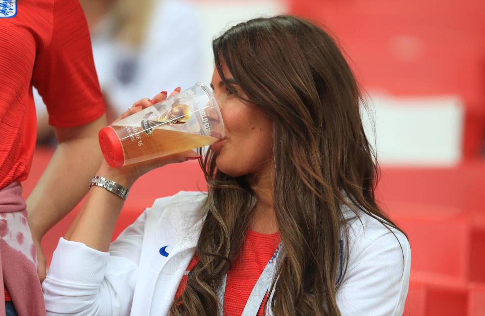Becky Vardy enjoys a beer in the stands before England kick off against Colombia