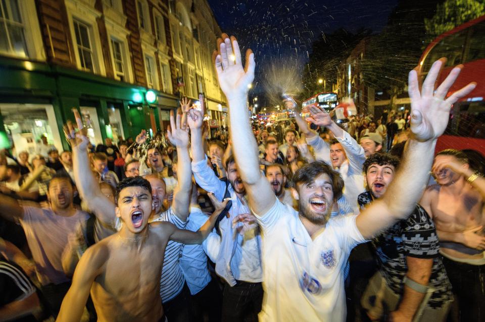  Fans in London celebrate the win in the street
