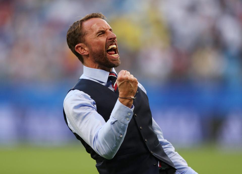  England manager Gareth Southgate celebrates after the match against Sweden