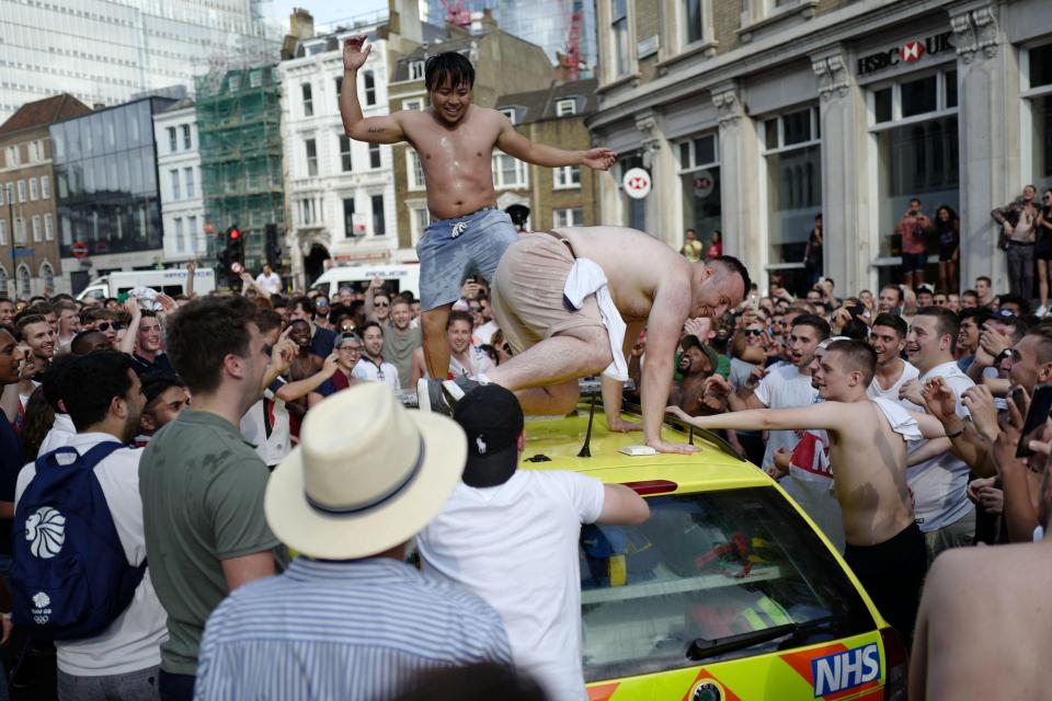  To topless louts clambered on top of the emergency vehicle as fans took over streets in London Bridge