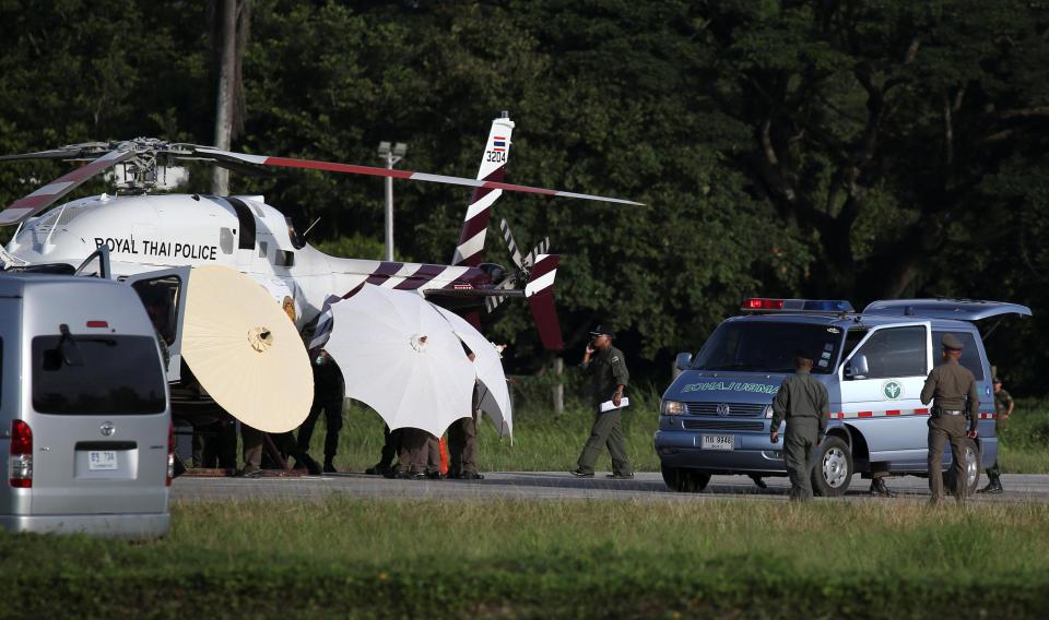  The boy is rushed to a helicopter by rescue workers
