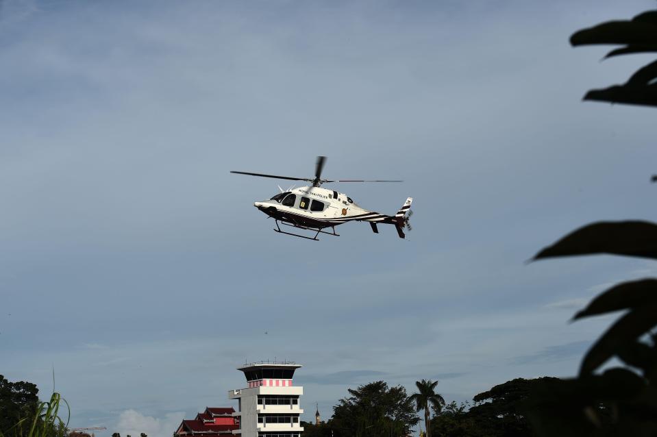 A helicopter takes off to carry one of the boys to hospital today