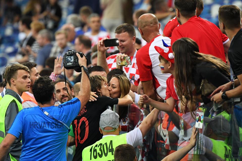  Modric kisses his wife Vanja after helping Croatia reach the semi-finals of Russia 2018