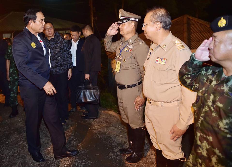  Thai Prime Minister Prayut Chan-o-cha, left, greeting authorities at the rescue site