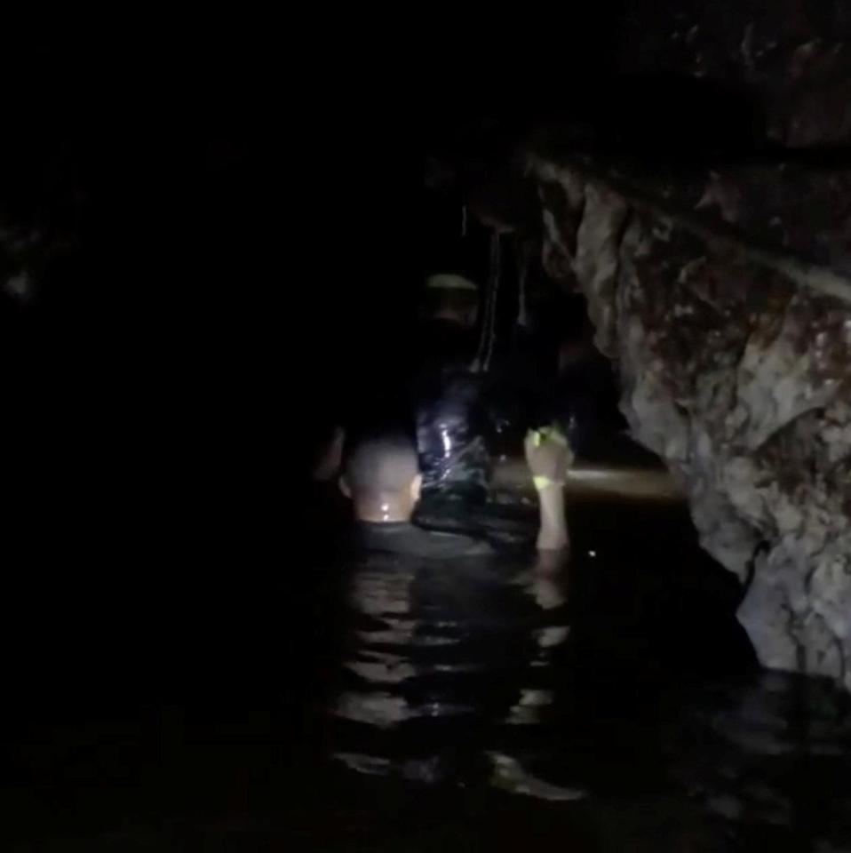  A rescue worker in the flooded cave in Thailand during the daring escape bid