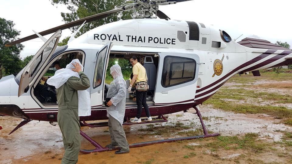  Rescue workers prepare a helicopter ahead of the evacuation of the remaining boys