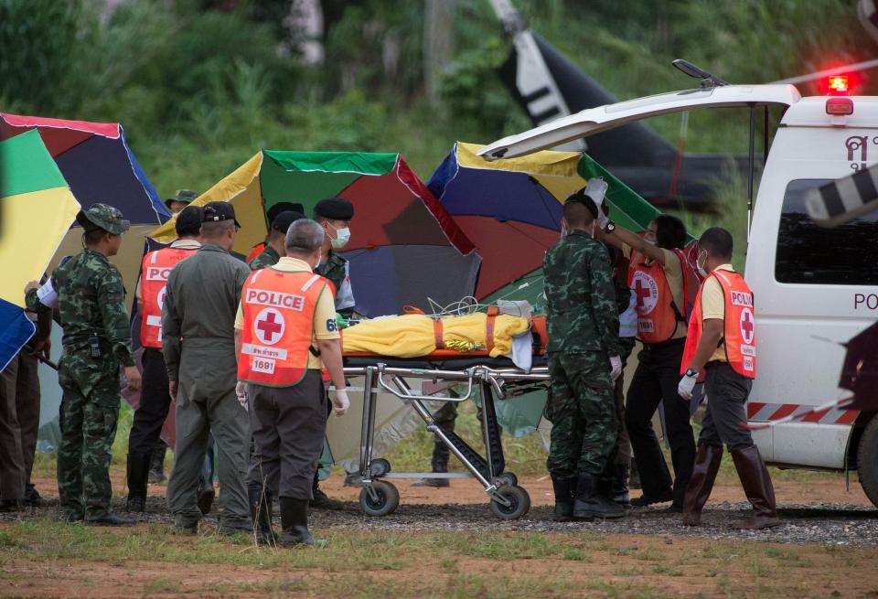  One of the brave children is stretchered into an ambulance as the rescue mission comes to an end