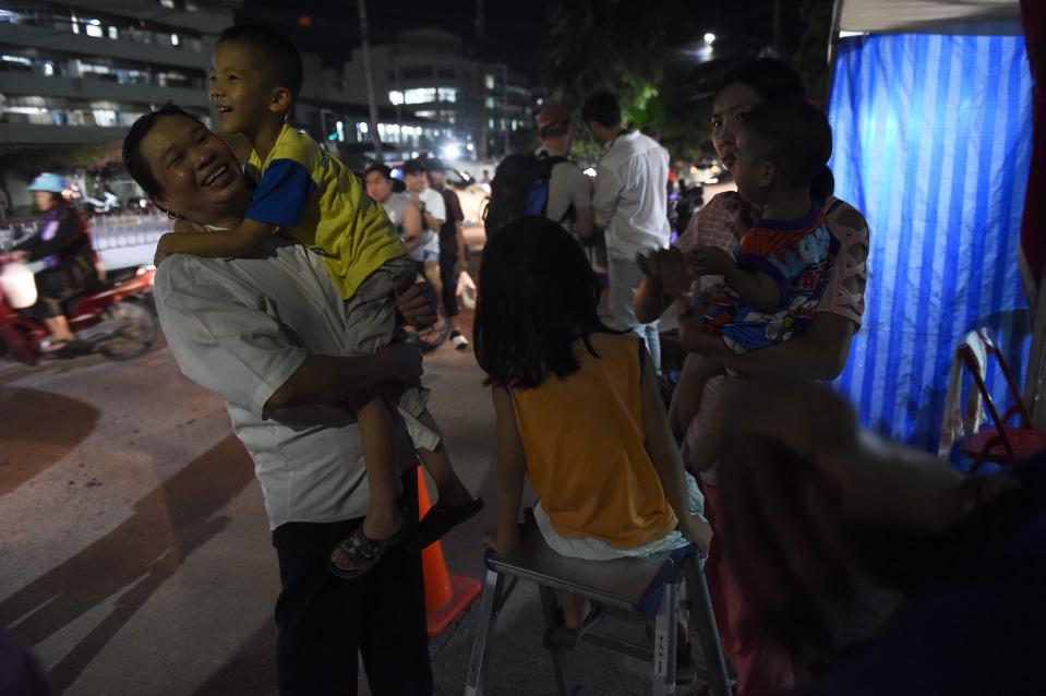  People in Thailand celebrate the successful rescue mission which has gripped the nation