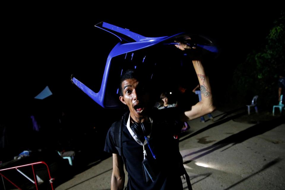  A journalist near the tunnel network looks overjoyed that the saga is over and that the boys are safe
