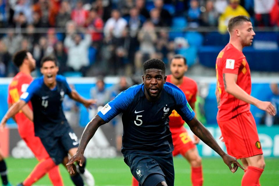 Defender Umtiti wheels away in celebration after scoring for France