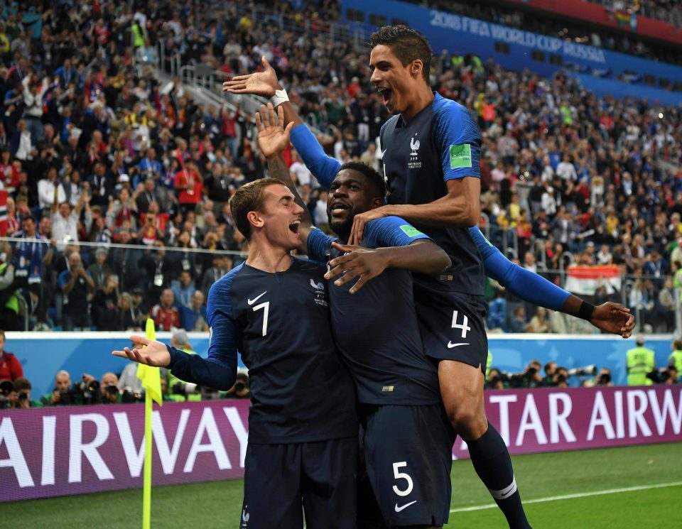 The French stars mob Samuel Umtiti after going ahead against France