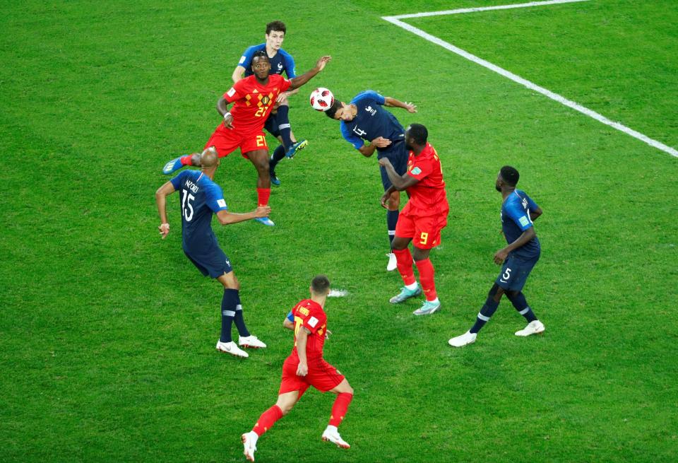 Raphael Varane makes one of several key defensive headers for Les Bleus in the semi-final