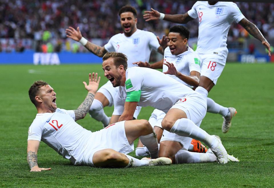  Kieran Trippier and the England team celebrate after scoring from a free kick against Croatia
