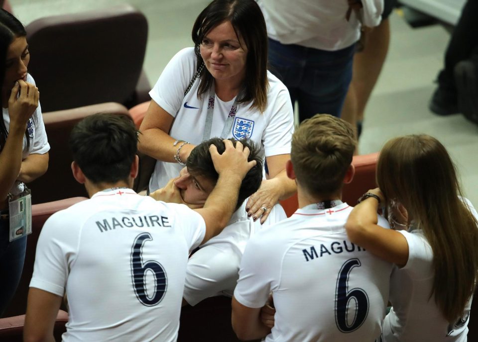 Harry Maguire being consoled by his family