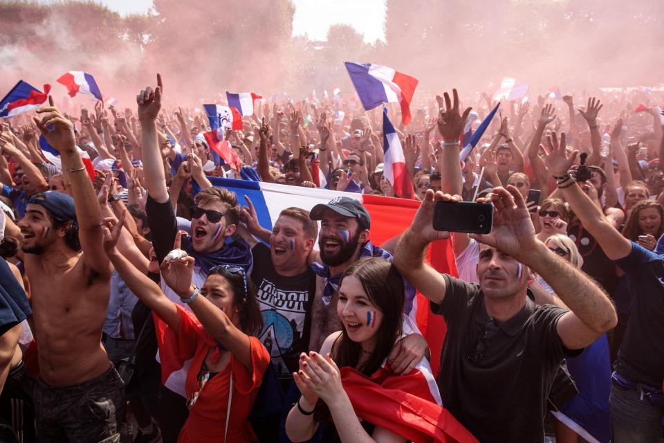 France supporters in Paris celebrate after winning the World Cup