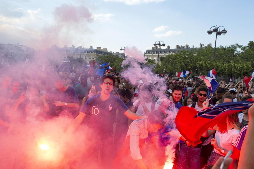 France supporters light flares in celebration after Russia triumph