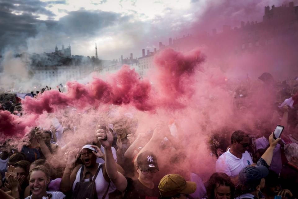 Jubilant France supporters light flares and party after Croatia win