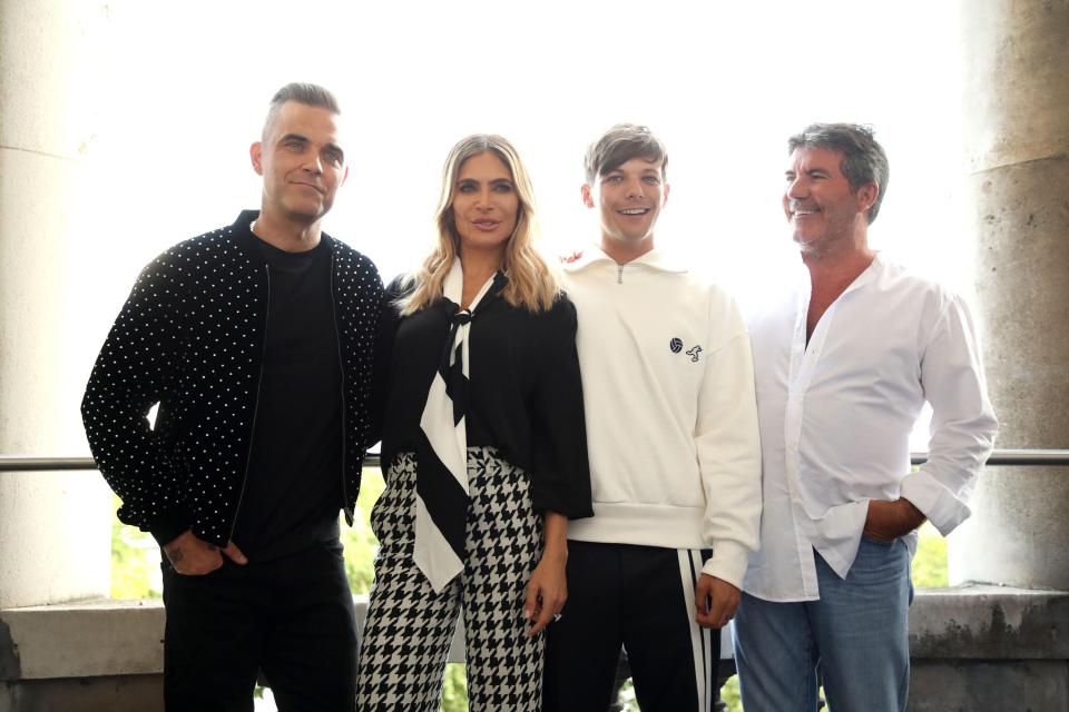  Robbie Williams' fans get ready for a new album - pictured with wife Ayda Filed, Louis Tomlinson and Simon Cowell during The X Factor 2018 launch