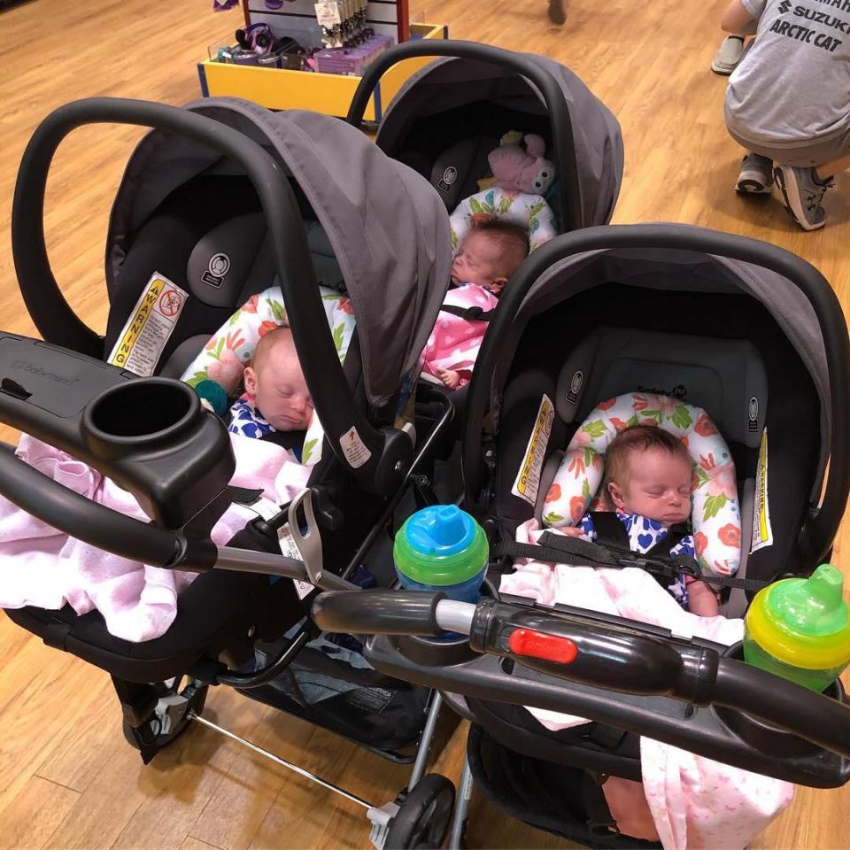  They've got their hands full with five babies - including three newborn triplets