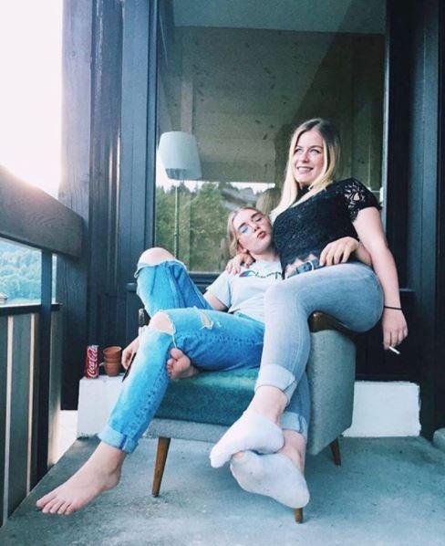  Ellie's last Instagram post showed her smiling with a friend