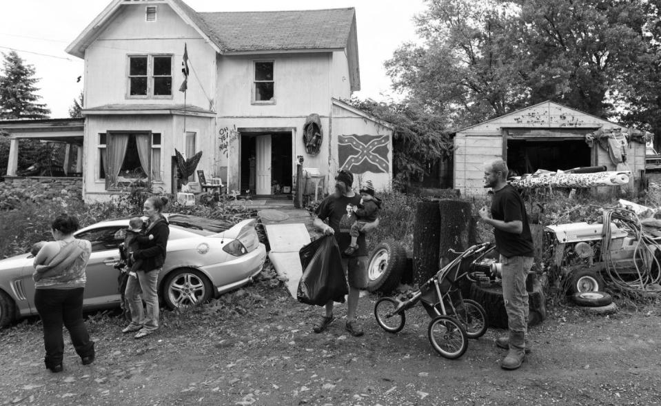 Members of two local white nationalist organisations prepare for a silent demonstration a few blocks away in opposition of the Black Lives Matter movement