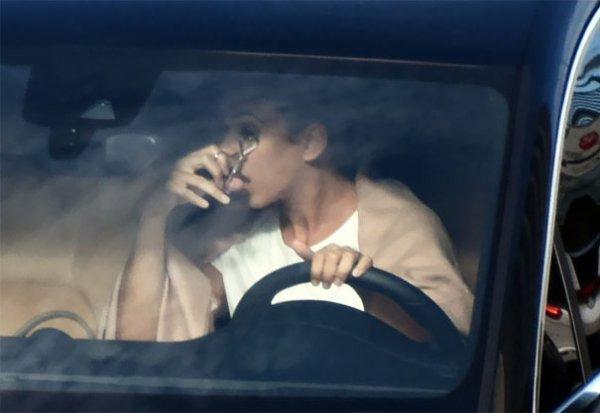  No part of this is safe as this driver curls her eyelashes behind the wheel