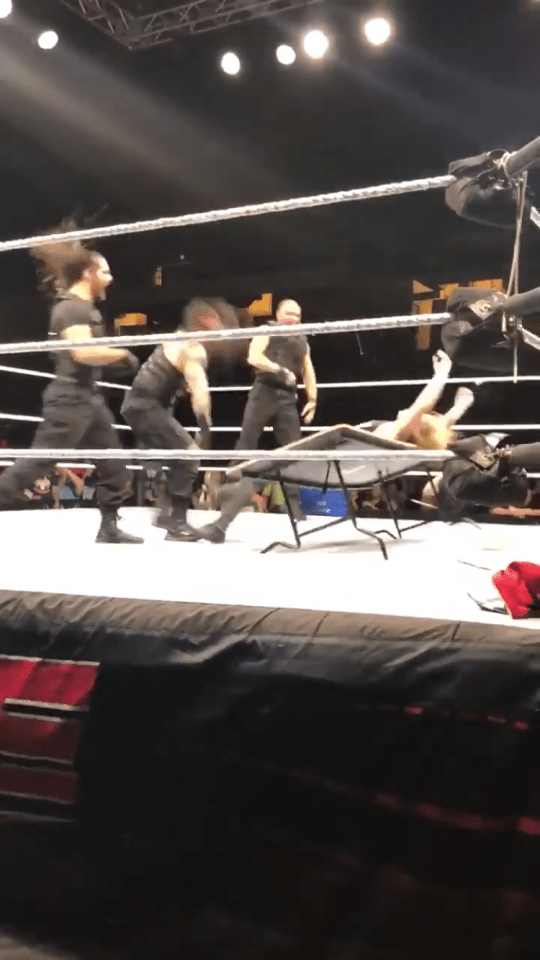 The trio slammed Ziggler down on to the table to the delight of the crowd