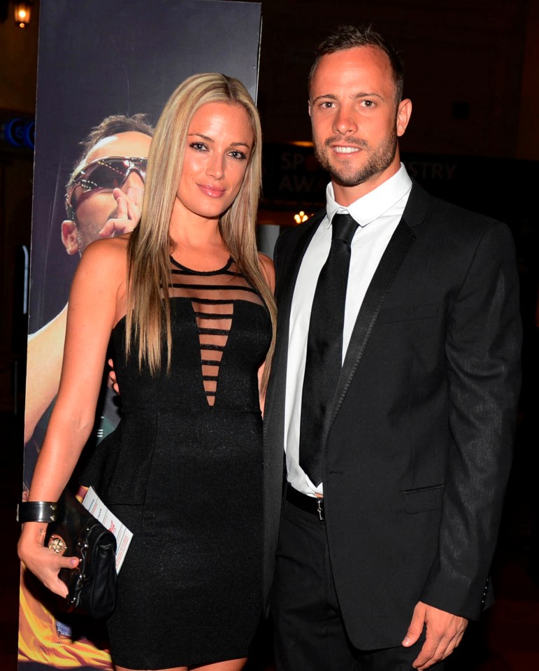  South African athlete Oscar Pistorius posing with model Reeva Steenkamp in 2013