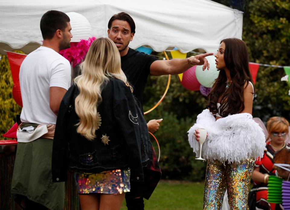  While Amber tried to defend herself, drama soon ensued when their boyfriends got involved