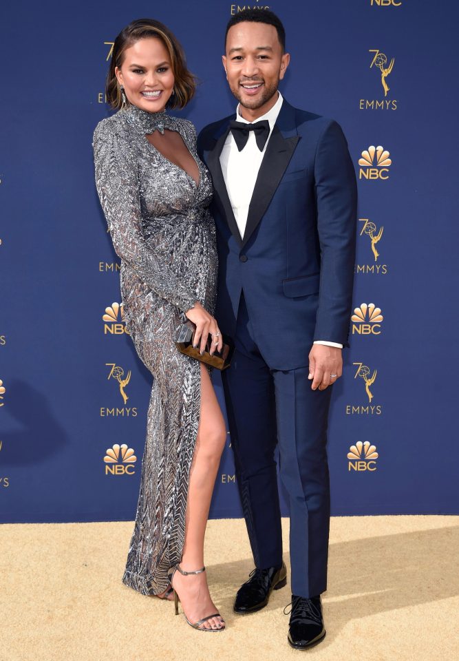  The mum-of-two cuddled up to her husband John Legend on the gold carpet